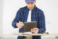 side view casual man with tablet working with tablet Royalty Free Stock Photo