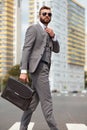 Side view on caucasian businessman walking with bag Royalty Free Stock Photo
