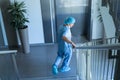 Male surgeon walking downstairs in hospital Royalty Free Stock Photo