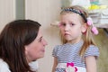 Side view of Caucasian mom and daughter having a conversation, girl is upset. Relations between mother and daughter Royalty Free Stock Photo