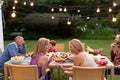 Happy family eating together at table Royalty Free Stock Photo