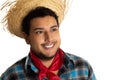 Cheerful Guy in traditional plaid clothes looking to the side. Festa Junina in Brazil, known as brazilian June