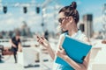 Calm girl using contemporary digital device outdoor Royalty Free Stock Photo