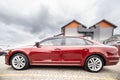 Side view of cherry red business sedan car Royalty Free Stock Photo