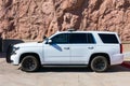 Side view of Chevrolet SUV white base model service U.S. government vehicle with push bumper