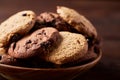 Side view of chocolate chip cookies on a wooden plate over rustic background, selective focus Royalty Free Stock Photo