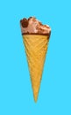 chocolate flavor ice cream cone with a bite on a blue background Royalty Free Stock Photo