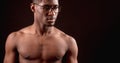 Side view close up cropped portrait of strong nacked Afro male in glasses