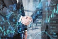 Side view and close up of men shaking hands on abstract glowing forex chart, map and arrows on index hologram, blurry office Royalty Free Stock Photo
