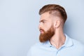 Side view close up portrait of handsome bearded young serious ma Royalty Free Stock Photo