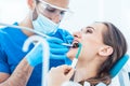 Young woman during painless oral treatment in the modern dental Royalty Free Stock Photo