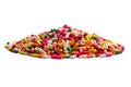 Side view closeup pile of colorful candy rainbow sprinkles isolated on white background Royalty Free Stock Photo