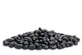 Side view closeup pile of uncooked black beans on white background Royalty Free Stock Photo