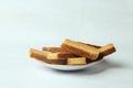 Side view closeup of piled rectangular pieces of bread on a plate