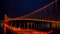 Side view of a colorful modern pedestrian bridge. Night in Osijek. Royalty Free Stock Photo