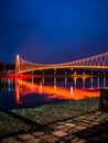 Side view of a colorful modern pedestrian bridge. Royalty Free Stock Photo