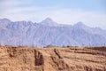 Side view of colorful mountains of Eilat against of blue sky with clouds Royalty Free Stock Photo