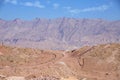 Side view of colorful mountains of Eilat against of blue sky with clouds Royalty Free Stock Photo