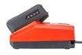 Side view of compact charger with connected 12V Li-ion battery in rubberized and glass-fiber reinforced casing with charge level Royalty Free Stock Photo