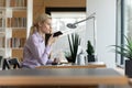 Side view confident businesswoman recording audio voice message on phone