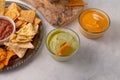 The side view of corn chips with avocado souse and cheese dip isolated on white background. Food concept Royalty Free Stock Photo