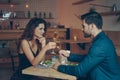 side view of couple clinking glasses of champagne during romantic dinner Royalty Free Stock Photo