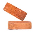 Side view of cracked old red or orange bricks in stack isolated on white background with clipping path Royalty Free Stock Photo