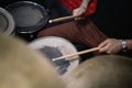 Side view of cropped drummer playing drums with sticks Royalty Free Stock Photo
