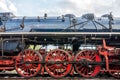 Side view on CSD, Czechoslovak steam locomotive, with huge, red spoke main wheels