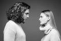 Side view. Curly man and blonde woman facing each other, eyes open. Concept of confrontation in the family. Boyfriend Royalty Free Stock Photo