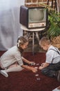 side view of cute kids playing dominoes together at home Royalty Free Stock Photo