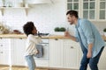 Happy man singing song with joyful little adopted daughter. Royalty Free Stock Photo