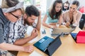 Self-employed young man analyzing a difficult task while working Royalty Free Stock Photo