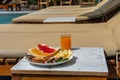 Side view of delicious breakfast at the swimming pool Royalty Free Stock Photo