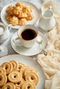 Side view of delicious dessert served. Butter and coconut cookies with cup of black coffee Royalty Free Stock Photo