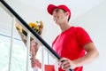 Delivery man holding flower bouquet gift