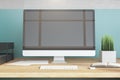 Side view designer desktop with blank black computer screen