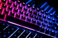 Side view of two illuminated RGB keyboards in the dark Royalty Free Stock Photo