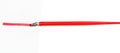 Side view of dip pen drawing red line by wide nib Royalty Free Stock Photo