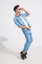 Side view of a dramatic casual man dancing Royalty Free Stock Photo