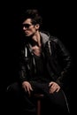 Side view of dramatic young man in leather jacket Royalty Free Stock Photo