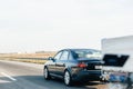 Side view of driving fast Audi with trailer on Hungarian highway