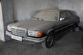 Side view of Dusty and forgotten classic mercedes-benz w201 in garage in Algiers, Algeria, November 12, 2017