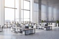 Side view on eco style minimalistic open space office with wooden tables, huge windows and white furniture Royalty Free Stock Photo