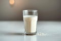 Side view elegance Glass of milk on white table, gray background