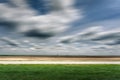 Side view on an empty asphalt road in blurred motion Royalty Free Stock Photo