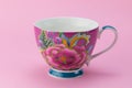 Side View Of Empty Tea Or Coffee Cup With Pink And Purple Flower