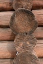 Side view of the end of a wooden building assembled from tree trunks Royalty Free Stock Photo