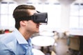 Side view of executive enjoying virtual reality headset at office Royalty Free Stock Photo