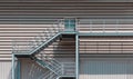 Side view of an external metal staircase as an Fire escape route at modern warehouse building Royalty Free Stock Photo